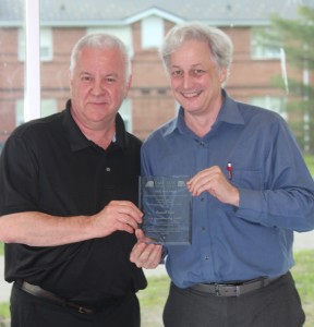 Daniel Côté (left) receiving the CASC Merit Award from CASC President, Darryl Reed